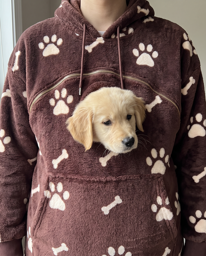 Puppy peeking out of the hoodie pouch porthole